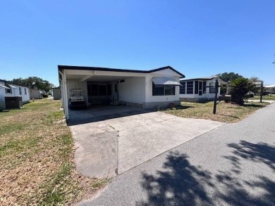 Welcome to your perfect year-round retreat! This charming 2 on Lake Henry Golf Club in Florida - for sale on GolfHomes.com, golf home, golf lot