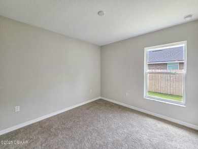 Recently purchased but never lived in! This beautiful 3-bedroom on The Grand Club - Pine Lakes Course in Florida - for sale on GolfHomes.com, golf home, golf lot