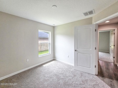 Recently purchased but never lived in! This beautiful 3-bedroom on The Grand Club - Pine Lakes Course in Florida - for sale on GolfHomes.com, golf home, golf lot