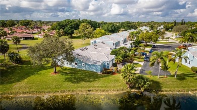 This charming two-bedroom, two-bathroom townhouse offers a on Woodmont Country Club in Florida - for sale on GolfHomes.com, golf home, golf lot