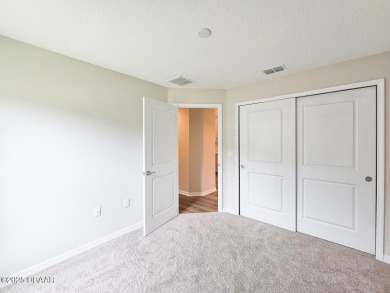 Recently purchased but never lived in! This beautiful 3-bedroom on The Grand Club - Pine Lakes Course in Florida - for sale on GolfHomes.com, golf home, golf lot