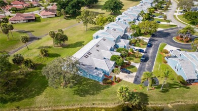 This charming two-bedroom, two-bathroom townhouse offers a on Woodmont Country Club in Florida - for sale on GolfHomes.com, golf home, golf lot