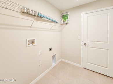 Recently purchased but never lived in! This beautiful 3-bedroom on The Grand Club - Pine Lakes Course in Florida - for sale on GolfHomes.com, golf home, golf lot