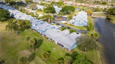 This charming two-bedroom, two-bathroom townhouse offers a on Woodmont Country Club in Florida - for sale on GolfHomes.com, golf home, golf lot