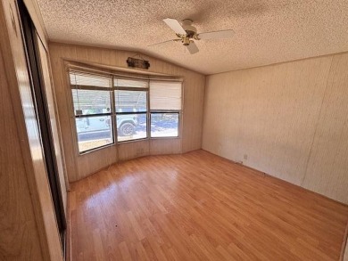 Welcome to your perfect year-round retreat! This charming 2 on Lake Henry Golf Club in Florida - for sale on GolfHomes.com, golf home, golf lot