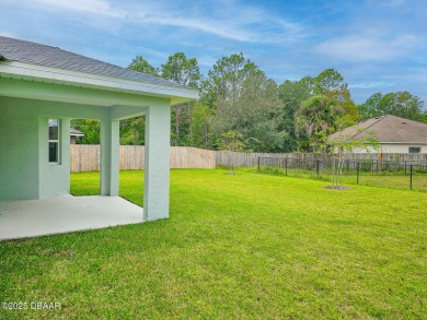 Recently purchased but never lived in! This beautiful 3-bedroom on The Grand Club - Pine Lakes Course in Florida - for sale on GolfHomes.com, golf home, golf lot
