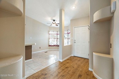 Set on a generous corner homesite in the desirable 55+ Villages on Quail Wood Greens Golf Course in Arizona - for sale on GolfHomes.com, golf home, golf lot