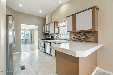 Set on a generous corner homesite in the desirable 55+ Villages on Quail Wood Greens Golf Course in Arizona - for sale on GolfHomes.com, golf home, golf lot