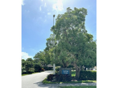 Come see this beautiful first floor end unit in charming on The Little Club in Florida - for sale on GolfHomes.com, golf home, golf lot