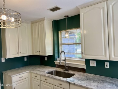 Welcome to your next chapter near Hickory Hill Golf Country Club on Mississippi National Golf Course in Mississippi - for sale on GolfHomes.com, golf home, golf lot