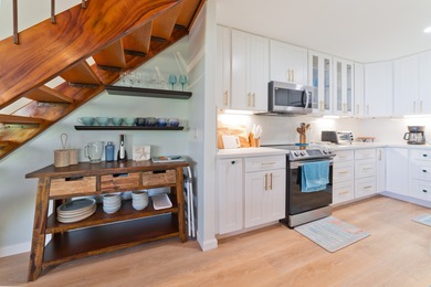 This stunning, upscale, totally renovated oceanfront view condo on Kona Country Club Golf Course in Hawaii - for sale on GolfHomes.com, golf home, golf lot