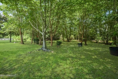 Welcome to your next chapter near Hickory Hill Golf Country Club on Mississippi National Golf Course in Mississippi - for sale on GolfHomes.com, golf home, golf lot