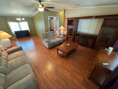 Centrally located, welcome to your new home in beautiful Winter on Lake Henry Golf Club in Florida - for sale on GolfHomes.com, golf home, golf lot
