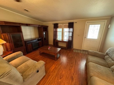 Centrally located, welcome to your new home in beautiful Winter on Lake Henry Golf Club in Florida - for sale on GolfHomes.com, golf home, golf lot