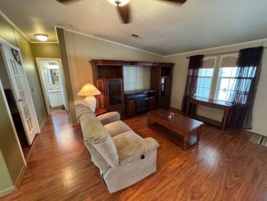 Centrally located, welcome to your new home in beautiful Winter on Lake Henry Golf Club in Florida - for sale on GolfHomes.com, golf home, golf lot