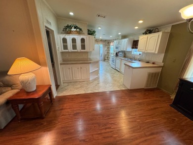Centrally located, welcome to your new home in beautiful Winter on Lake Henry Golf Club in Florida - for sale on GolfHomes.com, golf home, golf lot