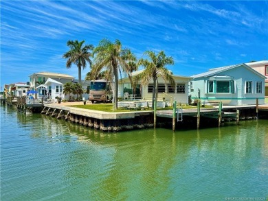 WATER, WATER EVERYWHERE! A RARE FIND--53 FEET OF OPEN WATER on Island Dunes Country Club in Florida - for sale on GolfHomes.com, golf home, golf lot