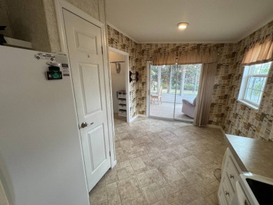 Centrally located, welcome to your new home in beautiful Winter on Lake Henry Golf Club in Florida - for sale on GolfHomes.com, golf home, golf lot