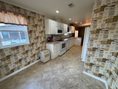 Centrally located, welcome to your new home in beautiful Winter on Lake Henry Golf Club in Florida - for sale on GolfHomes.com, golf home, golf lot