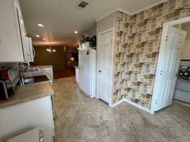 Centrally located, welcome to your new home in beautiful Winter on Lake Henry Golf Club in Florida - for sale on GolfHomes.com, golf home, golf lot