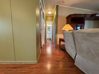 Centrally located, welcome to your new home in beautiful Winter on Lake Henry Golf Club in Florida - for sale on GolfHomes.com, golf home, golf lot