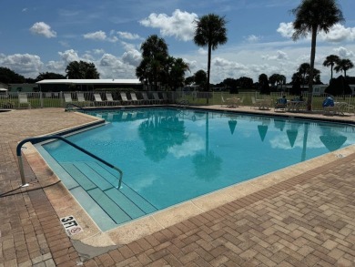 Centrally located, welcome to your new home in beautiful Winter on Lake Henry Golf Club in Florida - for sale on GolfHomes.com, golf home, golf lot