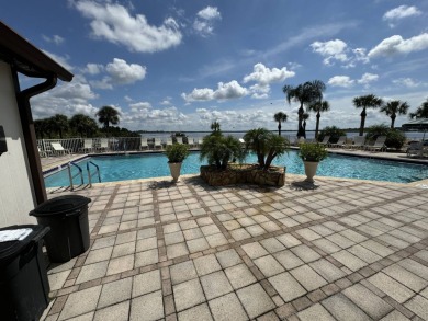 Centrally located, welcome to your new home in beautiful Winter on Lake Henry Golf Club in Florida - for sale on GolfHomes.com, golf home, golf lot