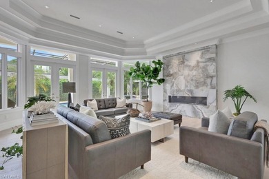 Experience elevated coastal living in this stunning Pelican Bay on Club at Pelican Bay Golf Course in Florida - for sale on GolfHomes.com, golf home, golf lot