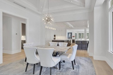 Experience elevated coastal living in this stunning Pelican Bay on Club at Pelican Bay Golf Course in Florida - for sale on GolfHomes.com, golf home, golf lot