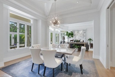 Experience elevated coastal living in this stunning Pelican Bay on Club at Pelican Bay Golf Course in Florida - for sale on GolfHomes.com, golf home, golf lot