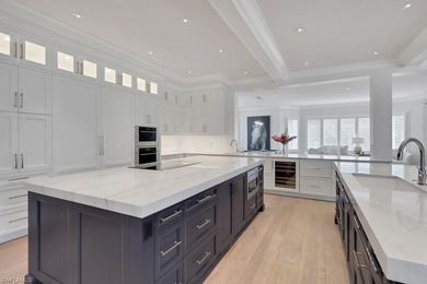 Experience elevated coastal living in this stunning Pelican Bay on Club at Pelican Bay Golf Course in Florida - for sale on GolfHomes.com, golf home, golf lot