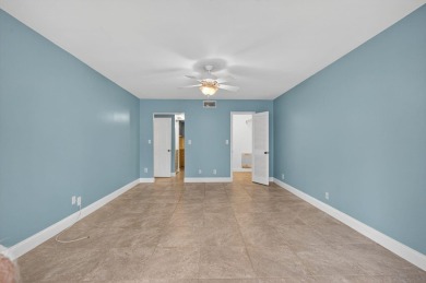 LIGHT AND SPACIOUS, FIRST FLOOR CORNER UNIT IN POPULAR 55+ on BallenIsles Golf and Country Club in Florida - for sale on GolfHomes.com, golf home, golf lot