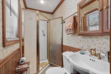 Welcome to this charming 4-bedroom, 3-bathroom all-brick ranch on Pine Lakes Country Club in South Carolina - for sale on GolfHomes.com, golf home, golf lot