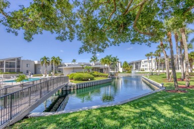 LIGHT AND SPACIOUS, FIRST FLOOR CORNER UNIT IN POPULAR 55+ on BallenIsles Golf and Country Club in Florida - for sale on GolfHomes.com, golf home, golf lot