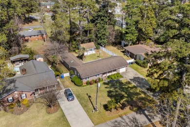 Welcome to this charming 4-bedroom, 3-bathroom all-brick ranch on Pine Lakes Country Club in South Carolina - for sale on GolfHomes.com, golf home, golf lot