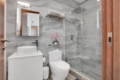 Luxurious coastal living in the exclusive island community of on Crandon Golf At Key Biscayne in Florida - for sale on GolfHomes.com, golf home, golf lot