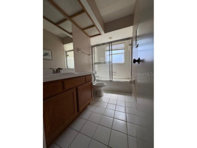 Light and bright 3BED/2BA Condominium with attached garage on East Lake Woodlands Country Club in Florida - for sale on GolfHomes.com, golf home, golf lot