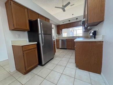 Light and bright 3BED/2BA Condominium with attached garage on East Lake Woodlands Country Club in Florida - for sale on GolfHomes.com, golf home, golf lot