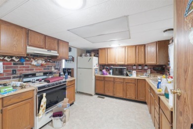 This 2 bedroom, 2 bath home with a covered carport wraps you in on High Point Golf Club, Inc. in Florida - for sale on GolfHomes.com, golf home, golf lot
