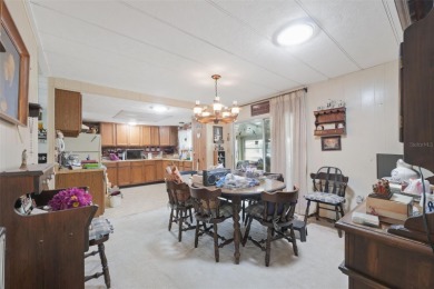 This 2 bedroom, 2 bath home with a covered carport wraps you in on High Point Golf Club, Inc. in Florida - for sale on GolfHomes.com, golf home, golf lot