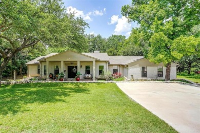 ENCHANTING 3-3-2 home nestled on a beautiful 1+ acre riverfront on Pecan Plantation Country Club in Texas - for sale on GolfHomes.com, golf home, golf lot