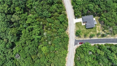 Don't miss this opportunity to create your custom lake lifestyle on The Club At Porto Cima in Missouri - for sale on GolfHomes.com, golf home, golf lot
