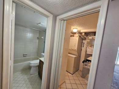 ** REDUCED PRICE ** Great water view from this 2nd floor villa on Isla Del Sol Yacht and Country Club in Florida - for sale on GolfHomes.com, golf home, golf lot