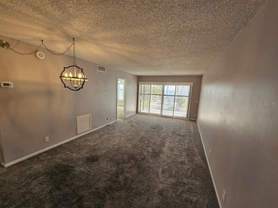 ** REDUCED PRICE ** Great water view from this 2nd floor villa on Isla Del Sol Yacht and Country Club in Florida - for sale on GolfHomes.com, golf home, golf lot