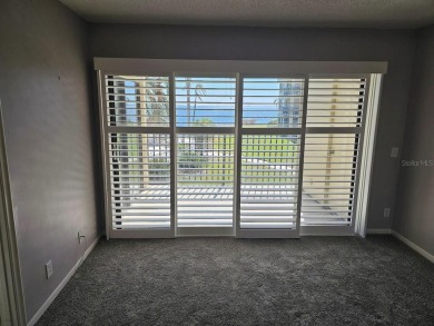 ** REDUCED PRICE ** Great water view from this 2nd floor villa on Isla Del Sol Yacht and Country Club in Florida - for sale on GolfHomes.com, golf home, golf lot