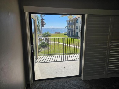 ** REDUCED PRICE ** Great water view from this 2nd floor villa on Isla Del Sol Yacht and Country Club in Florida - for sale on GolfHomes.com, golf home, golf lot