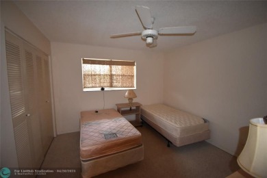 Discover convenience, and scenic beauty in this lovely 2-bedroom on Inverrary Country Club in Florida - for sale on GolfHomes.com, golf home, golf lot