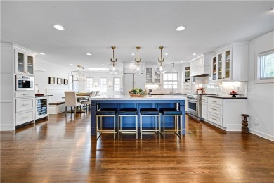 Wake up each day to the peaceful beauty of Lake Quivira in this on Lake Quivira Country Club in Kansas - for sale on GolfHomes.com, golf home, golf lot