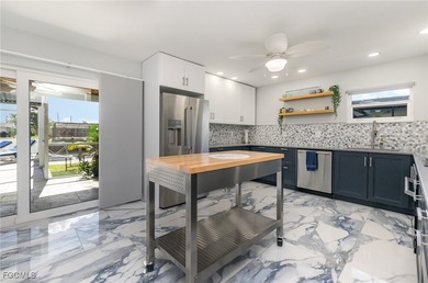 DISCOVER THE WATERFRONT LIFESTYLE YOU'VE BEEN DREAMING OF on El Rio Golf Course and Club in Florida - for sale on GolfHomes.com, golf home, golf lot