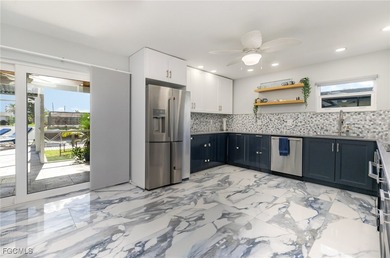 DISCOVER THE WATERFRONT LIFESTYLE YOU'VE BEEN DREAMING OF on El Rio Golf Course and Club in Florida - for sale on GolfHomes.com, golf home, golf lot